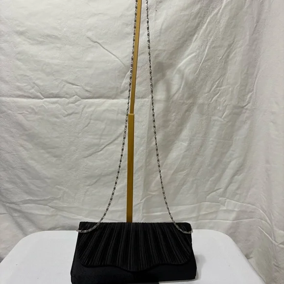 black pleated evening clutch bag with a detachable silver-tone chain strap. - Picture 2 of 5